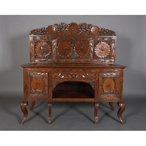 324 - A LATE 19TH CENTURY ANGLO-INDIAN WALNUT SIDEBOARD AND PAIR OF SINGLE CHAIRS, all-over carved in low ... 