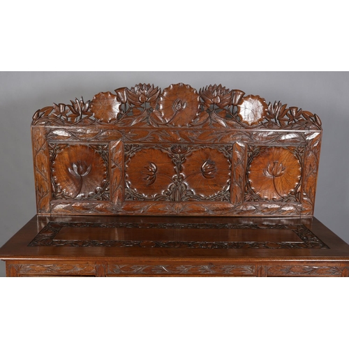 324 - A LATE 19TH CENTURY ANGLO-INDIAN WALNUT SIDEBOARD AND PAIR OF SINGLE CHAIRS, all-over carved in low ... 