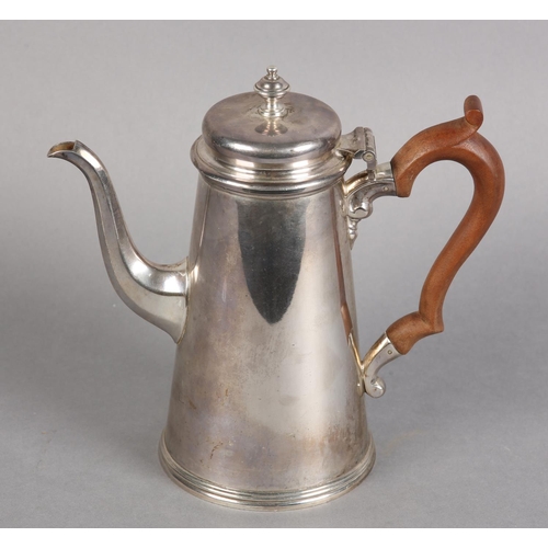 229 - A QUEEN ELIZABETH II SILVER COFFEE POT BY HARRODS OF LONDON, 1957, urnular finial, boxwood c-scroll ... 