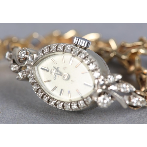 267 - AN OMEGA LADY'S DIAMOND SET MANUAL WRISTWATCH c.1969, the marquise shaped case no. AA7607 38094 with... 