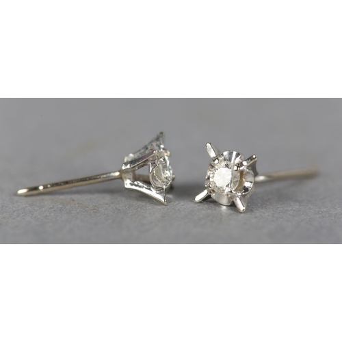 237 - A PAIR OF DIAMOND STUD EARRINGS, each set to the centre with a brilliant cut stone within a star of ... 