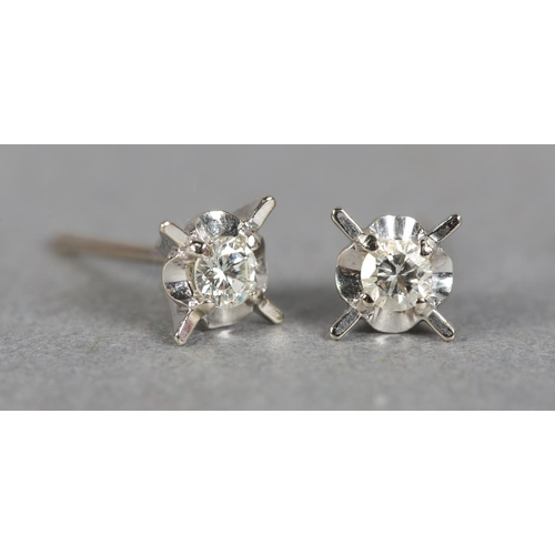 237 - A PAIR OF DIAMOND STUD EARRINGS, each set to the centre with a brilliant cut stone within a star of ... 