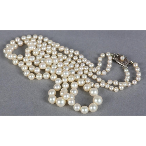 238 - A CULTURED PEARL NECKLACE BY MIKIMOTO c.1960, two rows of graduated pearls, approximate max diameter... 