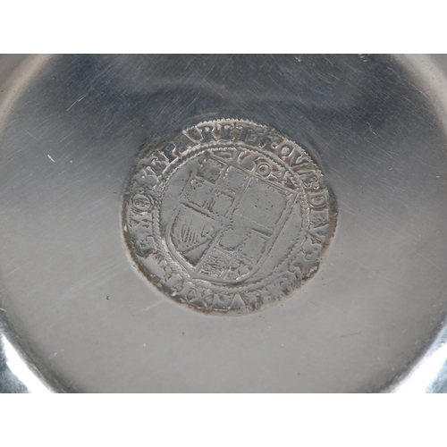 214 - A GEORGE V SILVER WINE TASTER, London 1924 D&J Welby, circular with serpentine handle and coin base,... 