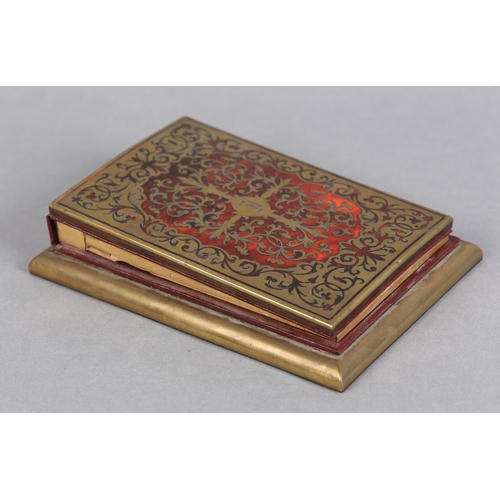 143 - A 19TH CENTURY BOULLE DESK PAD, having cut brass strapwork on a red tortoiseshell ground, etched wit... 