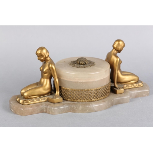 145 - AN ART DECO DRESSING TABLE STAND, the lidded pot having filigree gilt metal mount and finial, surmou... 