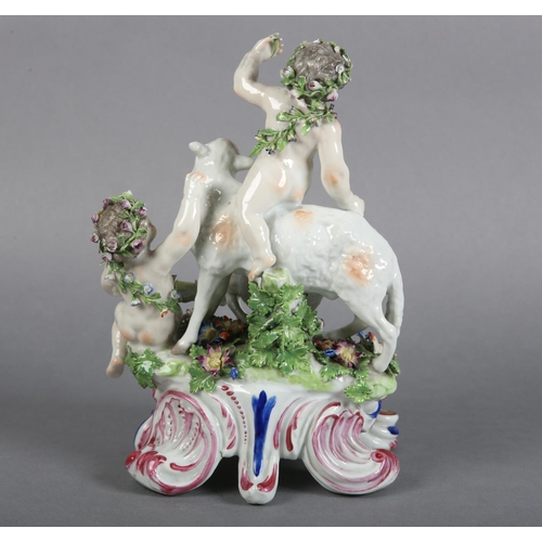 163 - A 19TH CENTURY PORCELAIN FIGURE GROUP OF BACCHUS, atop a sheep with suckling lamb together with anot... 