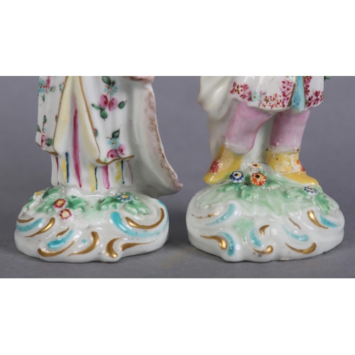 151 - A PAIR OF DERBY PORCELAIN FIGURES OF TURKS, male and female each on a flower strewn mound with 'C' s... 