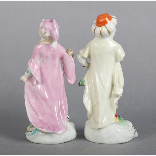 151 - A PAIR OF DERBY PORCELAIN FIGURES OF TURKS, male and female each on a flower strewn mound with 'C' s... 