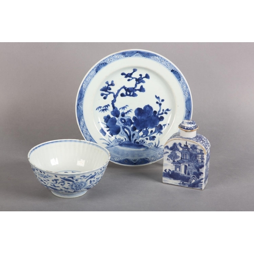 174 - AN 18TH CENTURY CHINESE BLUE AND WHITE PLATE painted with rocks issuing blossom within a diaper bord... 