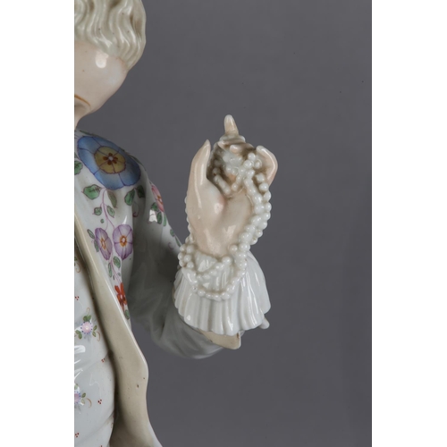 168 - A LATE 19TH CENTURY GERMAN PORCELAIN FIGURE OF A GENTLEMAN IN ELEGANT DRESS, proffering a string of ... 