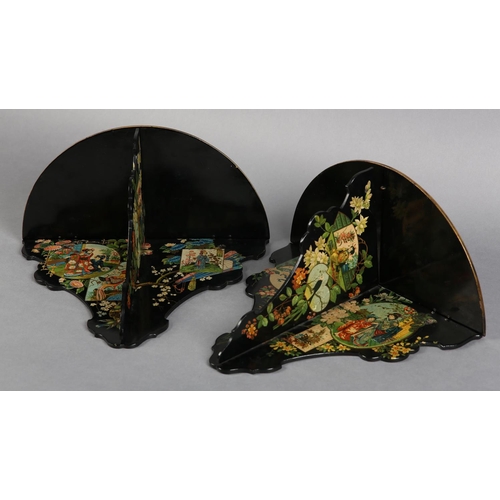 318 - A PAIR OF AESTHETIC MOVEMENT BLACK PAPIER MACHE FOLDING WALL BRACKET, decorated with polychrome and ... 