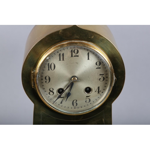 130 - AN ART NOUVEAU BRASS CASED MANTEL CLOCK, having a circular silvered dial with black Arabic numerals,... 