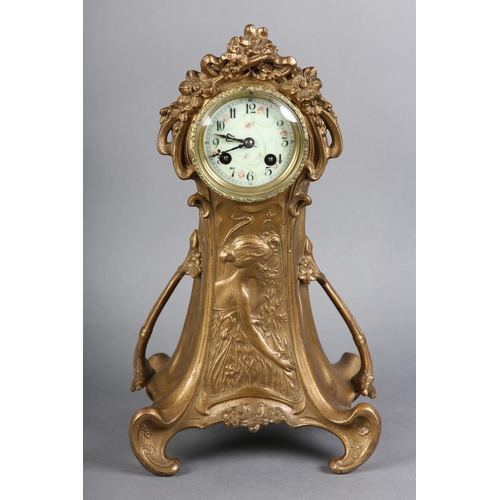 131 - AN ART NOUVEAU GILT METAL MANTEL CLOCK, having a circular porcelain dial with black Arabic numerals ... 