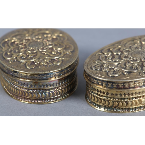 201 - A PAIR OF VICTORIAN SILVER GILT BOXES, London 1883, maker Rosenthal, Jacob & Co, of oval outline, th... 