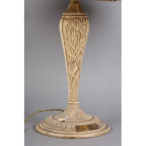 96 - A LATE ART NOUVEAU CAST METAL TABLE LAMP, the domed shade of slag glass overlaid with open panels of... 