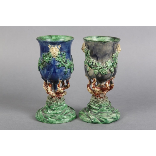 170 - A PAIR OF 19TH CENTURY MAJOLICA WINE GOBLETS c.1880, the bowls applied with lion masks and garlands ... 