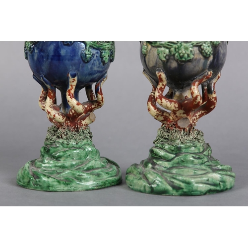 170 - A PAIR OF 19TH CENTURY MAJOLICA WINE GOBLETS c.1880, the bowls applied with lion masks and garlands ... 