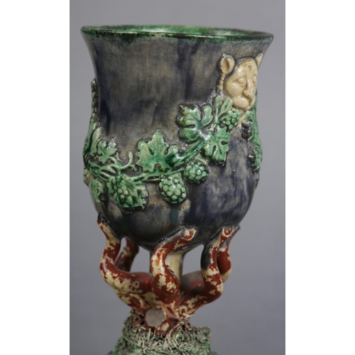 170 - A PAIR OF 19TH CENTURY MAJOLICA WINE GOBLETS c.1880, the bowls applied with lion masks and garlands ... 