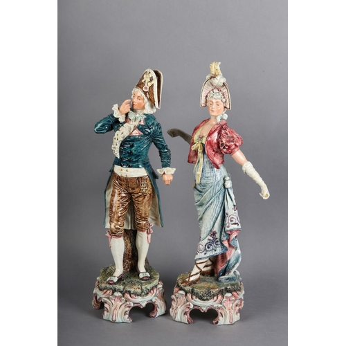 167 - A PAIR OF CONTINENTAL PORCELAIN FIGURES of a lady wearing bonnet and gathered dress, with arms exten... 