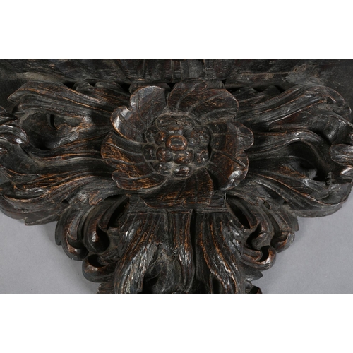 380 - A VICTORIAN OAK WALL BRACKET, rectangular with arcaded rim above a flower and foliate support, 72cm ... 