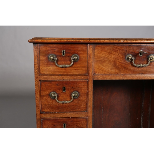 351 - A GEORGE III STYLE MAHOGANY KNEEHOLE DESK having a drawer to the centre above a recessed cupboard, f... 