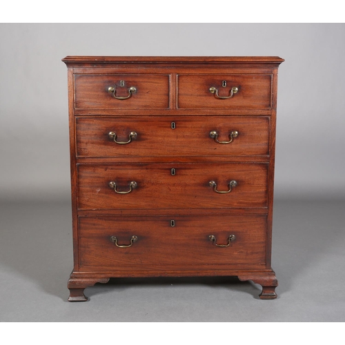 353 - A GEORGE III MAHOGANY CHEST of two short and three long graduated cockbeaded drawers with brass swin... 