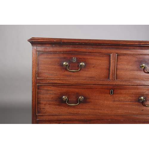 353 - A GEORGE III MAHOGANY CHEST of two short and three long graduated cockbeaded drawers with brass swin... 