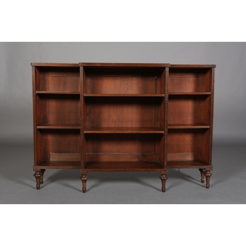 355 - A 19TH CENTURY MAHOGANY DWARF BREAKFRONT OPEN BOOKCASE, on vase turned feet, 131cm wide x 31cm deep ... 