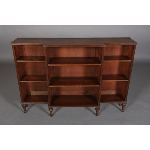 355 - A 19TH CENTURY MAHOGANY DWARF BREAKFRONT OPEN BOOKCASE, on vase turned feet, 131cm wide x 31cm deep ... 