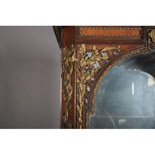 356 - A LATE 19TH/EARLY 20TH CENTURY KINGWOOD AND GILT METAL MOUNTED VITRENE, mirror lined, having a mould... 