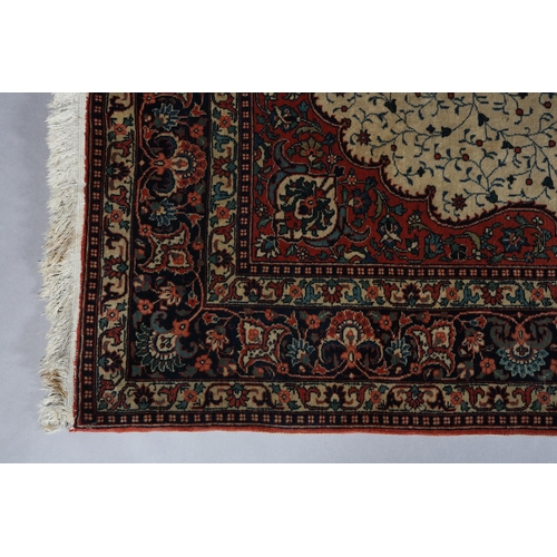 308 - A KASHAN CARPET, the ivory field having a central blue medallion filled with flowers, within a surro... 