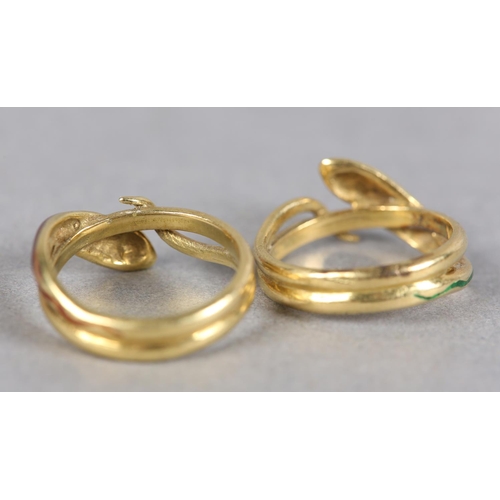 251 - A PAIR OF INTERLOCKING ENAMEL SNAKE RINGS in 18ct gold c1971, each ring set with black champlevé and... 