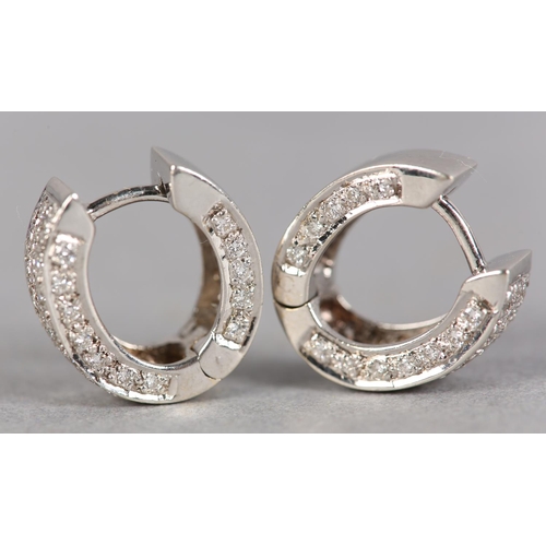 235 - A PAIR OF DIAMOND EARRINGS, each set with brilliant cut stones to a hinged cuff fitting in white met... 