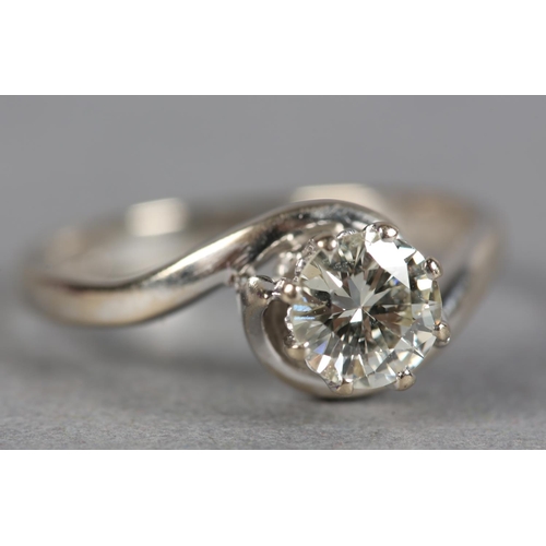 239 - A SINGLE STONE DIAMOND RING in 18ct white gold, the brilliant cut stone claw set in a crossover sett... 