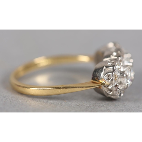 241 - A DIAMOND CLUSTER RING c1970 claw set with three graduated brilliant cut stones, raised against a su... 