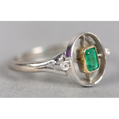 243 - AN ART DECO STYLE EMERALD AND DIAMOND THREE STONE RING in 18ct white and yellow gold by Ogden’s of H... 