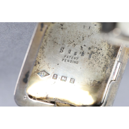 270 - AN ART DECO PURSE WATCH BY SAPHO, in silver engine turned folding case no. 2592, Birmingham 1932, Sw... 