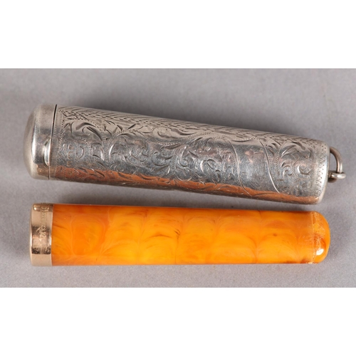 210 - AN EDWARD VII AMBER CIGAR HOLDER WITH 9CT GOLD FERRULE, within a silver case, all over foliate scrol... 