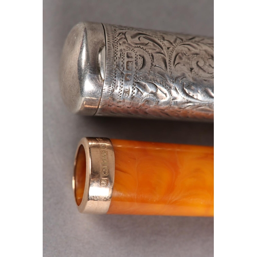 210 - AN EDWARD VII AMBER CIGAR HOLDER WITH 9CT GOLD FERRULE, within a silver case, all over foliate scrol... 