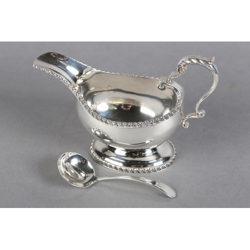 222 - A QUEEN ELIZABETH II SILVER SAUCE BOAT, Birmingham 1957, Charles Green & Co Ltd, with leaf capped sc... 