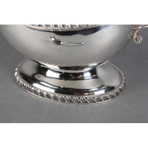 222 - A QUEEN ELIZABETH II SILVER SAUCE BOAT, Birmingham 1957, Charles Green & Co Ltd, with leaf capped sc... 