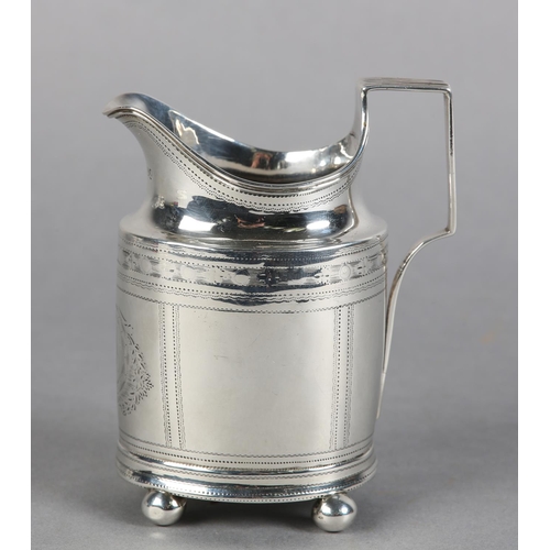 211 - A GEORGE III SILVER BRIGHTCUT CREAM JUG, London 1796, of oval outline with bracket handle, engraved ... 