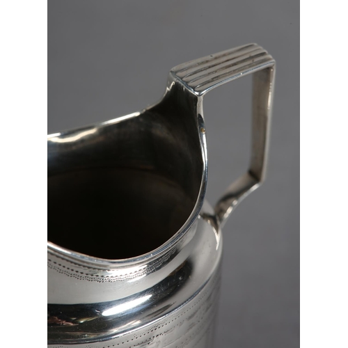 211 - A GEORGE III SILVER BRIGHTCUT CREAM JUG, London 1796, of oval outline with bracket handle, engraved ... 