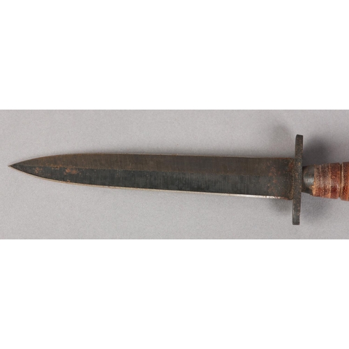 106 - A COMMANDO STYLE DAGGER, with tapering fluttered diamond shaped blued blade, iron cross piece, stack... 