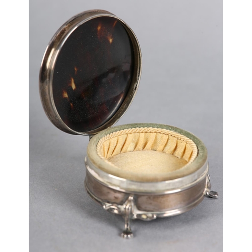 197 - A LATE 19TH CENTURY TORTOISESHELL AND SILVER JEWELLERY BOX, Birmingham 1922, circular with silk line... 