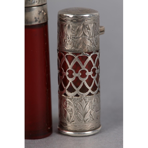 198 - AN EDWARD VII SILVER AND RUBY GLASS LINED SCENT BOTTLE, filigree band with engraved silver top and b... 