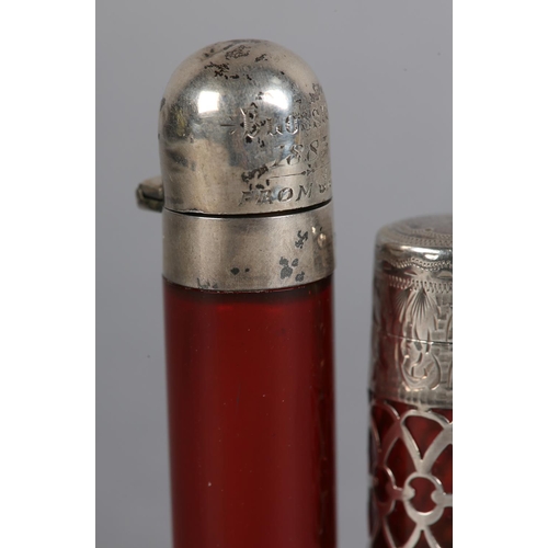 198 - AN EDWARD VII SILVER AND RUBY GLASS LINED SCENT BOTTLE, filigree band with engraved silver top and b... 