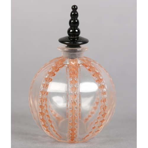 200 - A FRENCH ART DECO SPHERICAL GLASS SCENT BOTTLE, the clear glass body moulded with coral stained vert... 