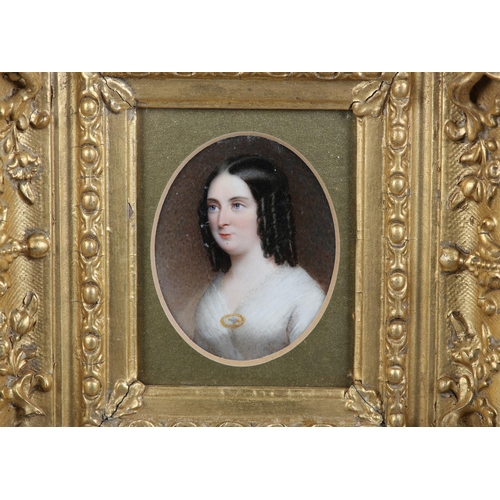 184 - A 19TH CENTURY PORTRAIT MINIATURE OF A LADY, c.1840, head and shoulders, her hair in ringlets, weari... 